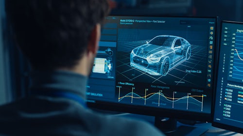 Man reviewing virtual car on computer screen